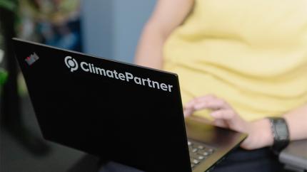 Laptop with ClimatePartner logo