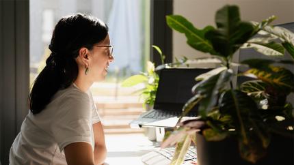 Female ClimatePartner employee working at the computer