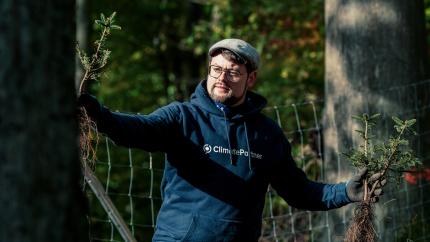 man-holding-plant