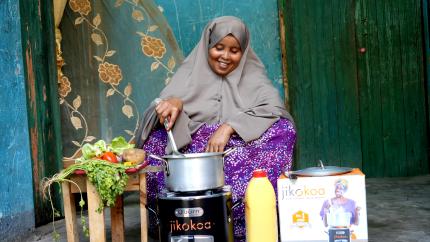 woman cooking using a improved cookstove 
