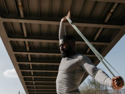 A man working out with a band