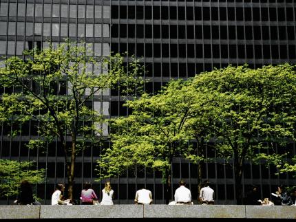 people sitting in front of building