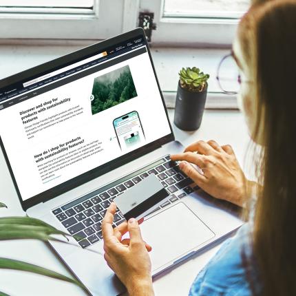Woman with laptop shopping on Amazon