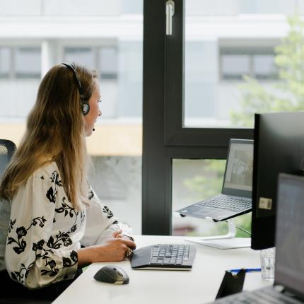 Woman is on the phone with client