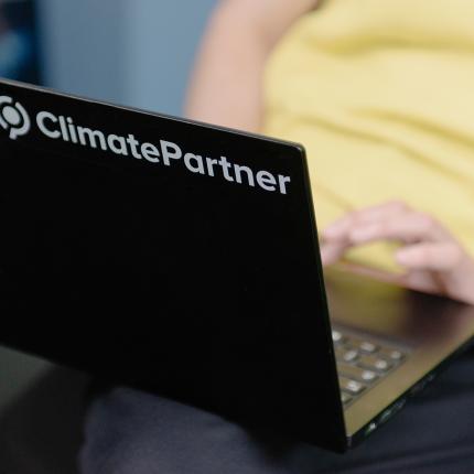 ClimatePartner customer manager typing on laptop