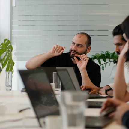 ClimatePartner team meeting and discussing