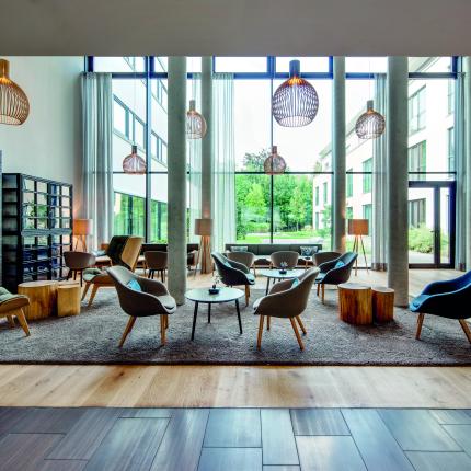 Interior of Fürstefelder Hotel lobby with table and chairs