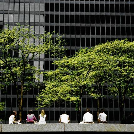 people sitting in front of building