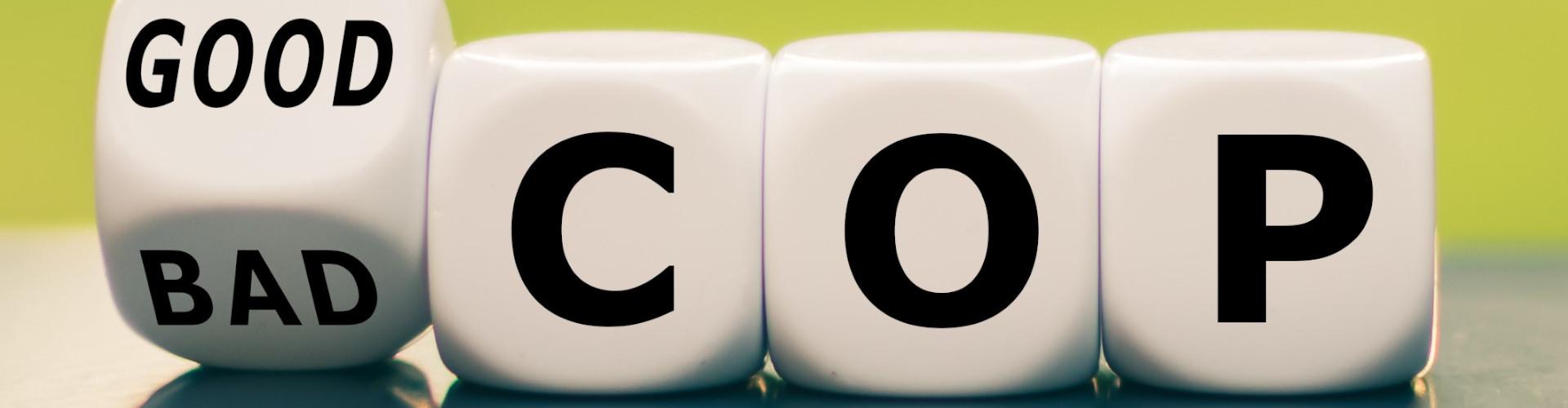 UN-Klimakonferenz: Good COP, bad COP? Vier Würfel. Der erste zeigt "good/bad", und wird von einem Finger auf der Kippe zwischen den Wörtern gehalten. Die anderen drei zeigen die Buchstaben C, O und P.