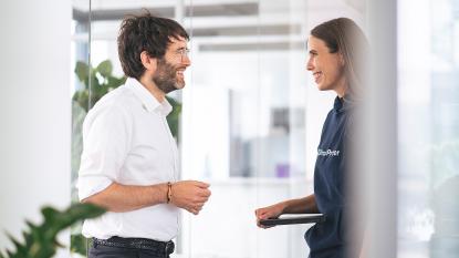 Man and woman in office talking