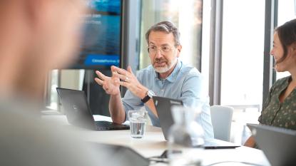 man in office talking friendly